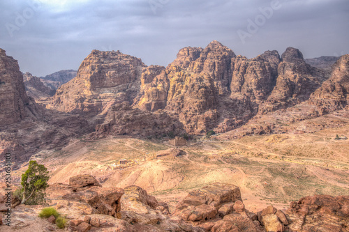 Al Habis mountain behind Qasr al Bint in Petra, Jordan photo