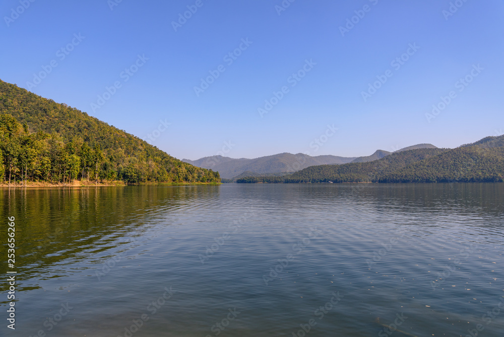 Outdoor scenery landscape of lake, mountain, forest and waterside at Mae NgudSomboonChol dam in Chiang Mai, Thailand.