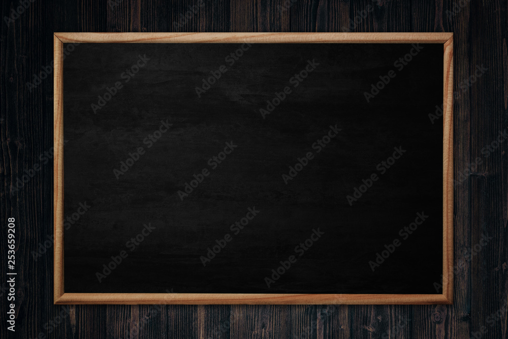 Abstract blackboard or chalkboard with frame on wooden background. Abstract blackboard or chalkboard with frame on wooden background.