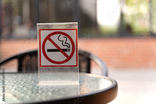 Don't smoke sign with bokeh background with shopping place photo