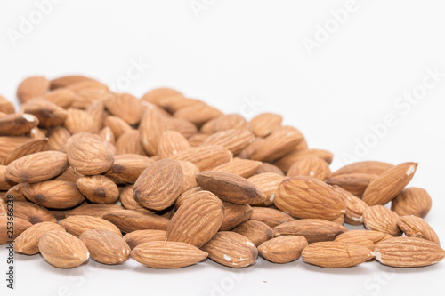 Raw natural organic close up Almonds on isolate white background.Close up Almond seeds.