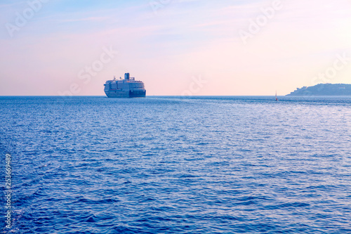 big cruise liner sailing on the horizon 