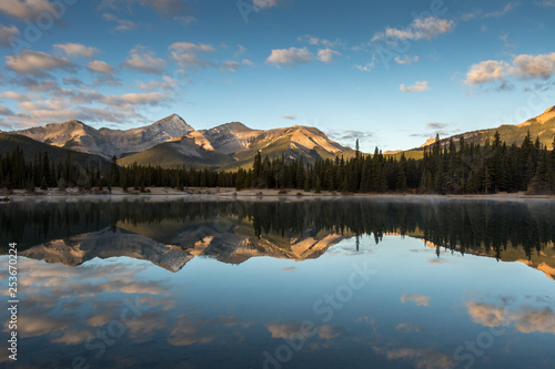 reflection of mountains in a pond