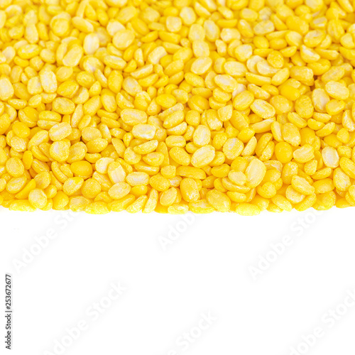 yellow split mung dal or moong dal pile isolated on white background