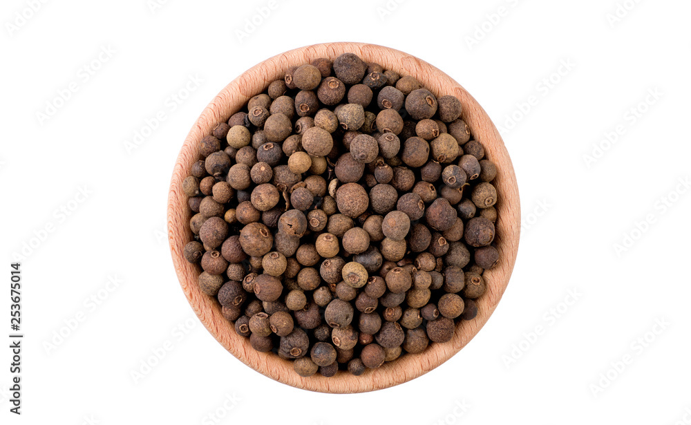 allspice in wooden bowl isolated on white background. Spices and food ingredients. allspice in wooden bowl isolated on white background. Spices and food ingredients.