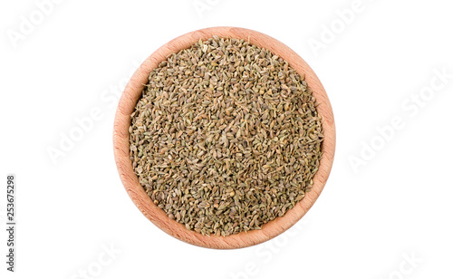 anise seeds in wooden bowl isolated on white background. Spices and food ingredients.