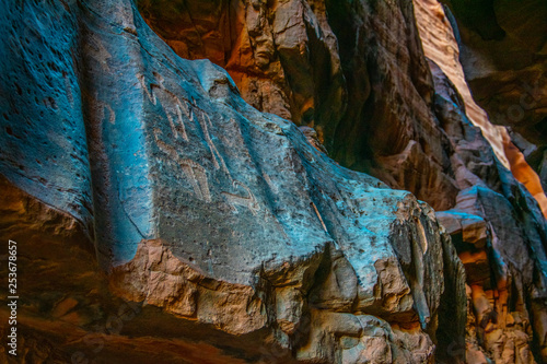 Ancient inscriptions at Khazali siq at Wadi Rum desert in jordan photo