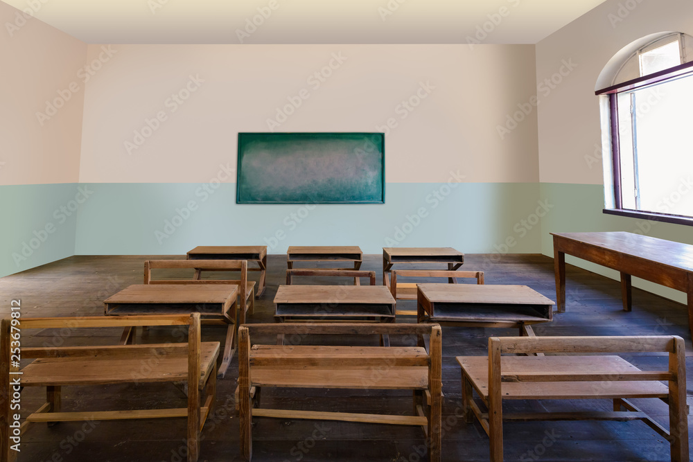 Antique classroom in school with Rows of empty wooden desks Antique classroom in school with Rows of empty wooden desks