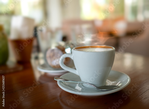 Selective focus of hot coffee on the table