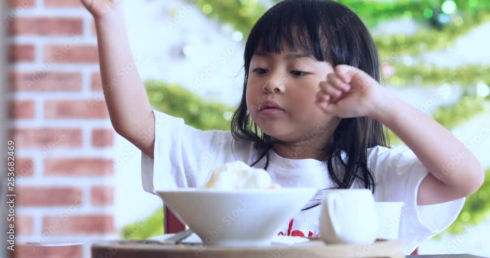 Cute Girl Eating Ice-Cream,little girl with ice cream on colorful background,Asian kid eating ice cream Cute Girl Eating Ice-Cream,little girl with ice cream on colorful background,Asian kid eating ice cream