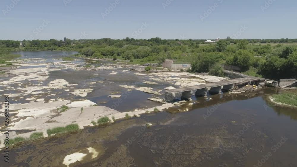 aerial broken train bridge over river rock bed beautiful flight pattern aerial broken train bridge over river rock bed beautiful flight pattern