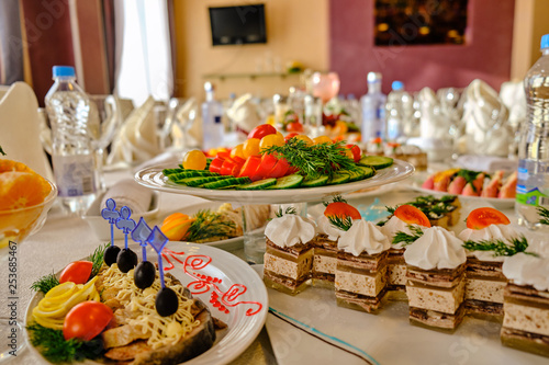 festive food on the table. A collage of different food in a restaurant. The concept of healthy eating and diet