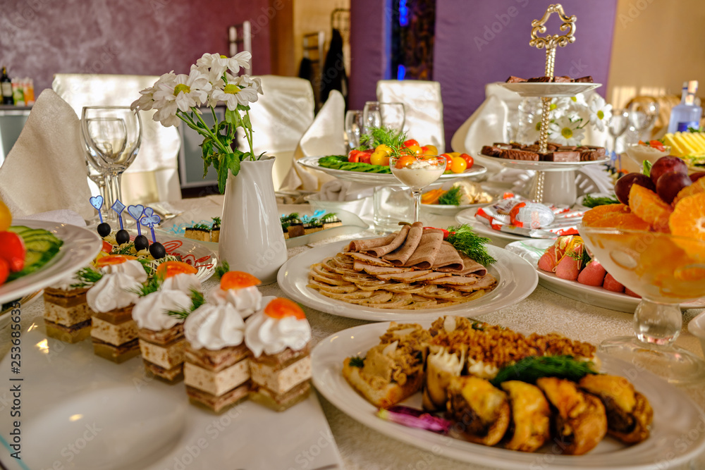 Fototapeta premium festive food on the table. A collage of different food in a restaurant. The concept of healthy eating and diet