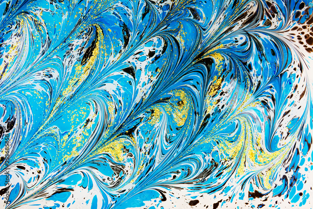 Abstract beautiful drawing of Ebru .Turkish style of painting Ebru on water with acrylic paints swirls waves.A stylish combination of natural luxury Abstract beautiful drawing of Ebru .Turkish style of painting Ebru on water with acrylic paints swirls waves.A stylish combination of natural luxury