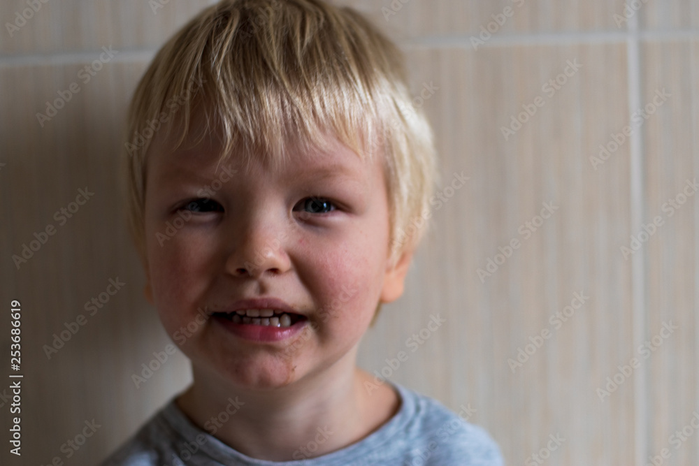 beautiful blond boy holds colored pencil in his teeth. Drawing lessons in group of preschoolers. Selective Focus, shallow depth of field beautiful blond boy holds colored pencil in his teeth. Drawing lessons in group of preschoolers. Selective Focus, shallow depth of field