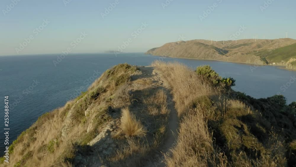 Ridge line hiking trail in New Zealand, forward dolly as sunsets 4k Ridge line hiking trail in New Zealand, forward dolly as sunsets 4k