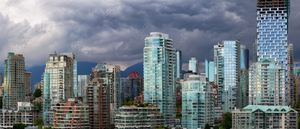 Naklejka premium Panoramic view of Downtown City Buildings during a vibrant evening. Taken in Vancouver, British Columbia, Canada.