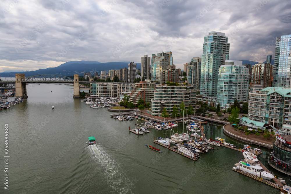 Downtown Vancouver, British Columbia, Canada - June 14, 2018: Aerial view of False Creek during a vibrant summer sunset.