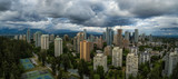 Aerial Panoramic view of residential homes in a modern city during a vibrant summer cloudy day. Taken in Burnaby, Vancouver, BC, Canada.