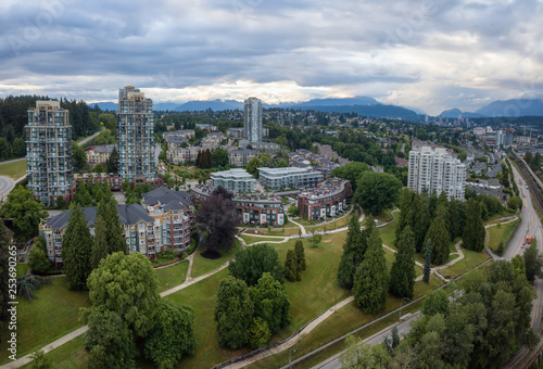 Aerial view of residential homes in a modern city during a vibrant summer sunset. Taken in New Westminster, Vancouver, BC, Canada.