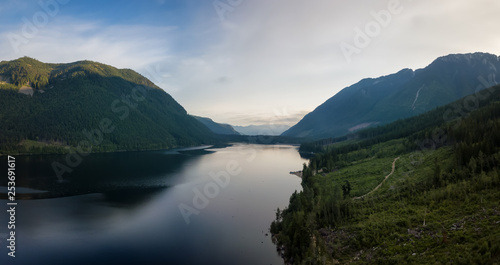 Aerial view of a scenic lake in the Canadian Mountain Landscape during a vibrant summer sunrise. Taken at Jones Lake near Chilliwack and Hope, East of Vancouver, BC, Canada. © edb3_16