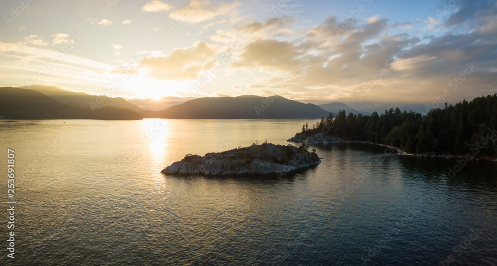 Aerial view of a beautiful Canadian Landscape during a cloudy summer sunset. Taken in Whytecliff Park, Horseshoe Bay, North Vancouver, BC, Canada. Aerial view of a beautiful Canadian Landscape during a cloudy summer sunset. Taken in Whytecliff Park, Horseshoe Bay, North Vancouver, BC, Canada.