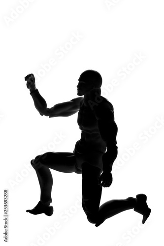 Silhouette of a man in a pose on his knee on a white background