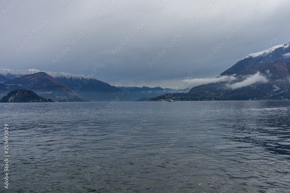 Italy, Varenna, Lake Como, a body of water with a mountain in the background