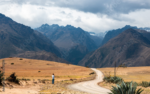 Tourist taking photo of mointains in Peru