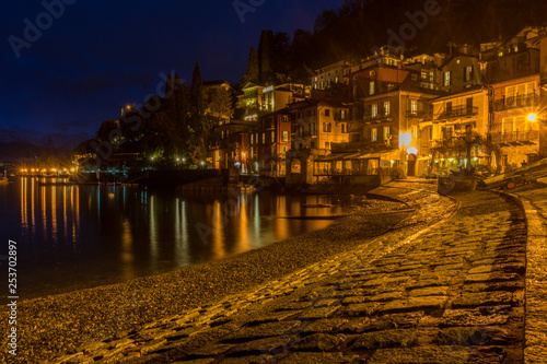 Italy, Varenna, Lake Como, illuminated fishing village at night