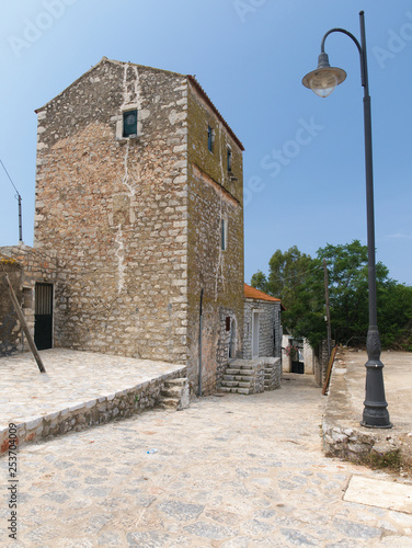 Wallpaper Mural Tower house paved street and lamp post in Mani, Greece Torontodigital.ca