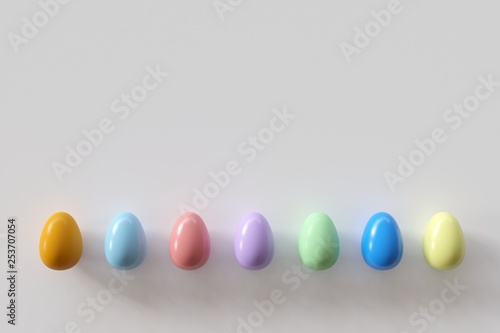 Colorful eggs on white background. Minimal Easter idea.