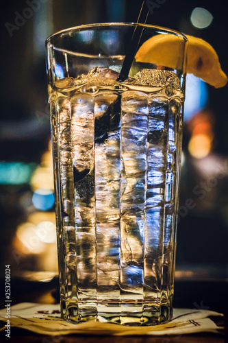 Drink with a lemon. Restaurant drink with lemon.