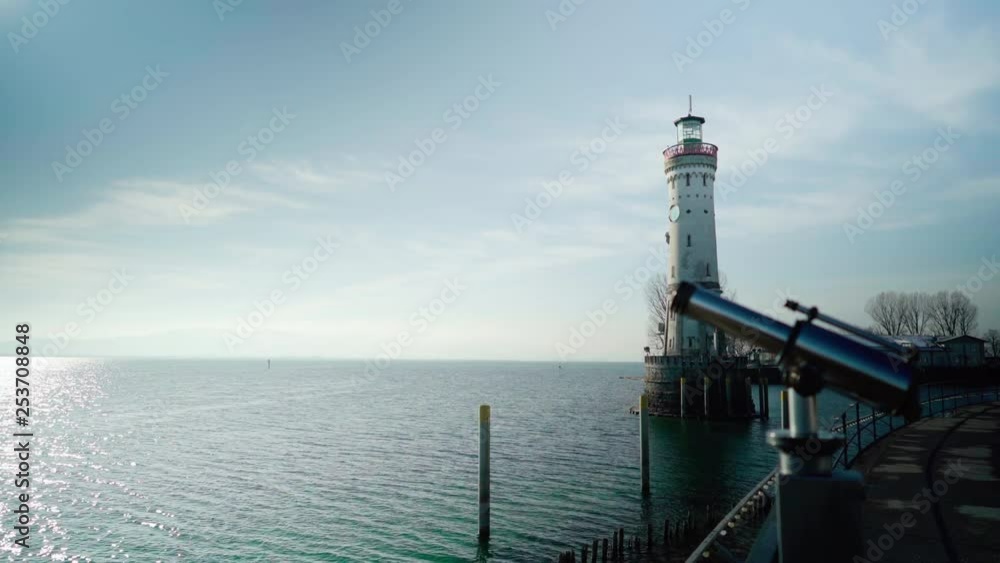 Ocean side view with light tower and binoculars Ocean side view with light tower and binoculars