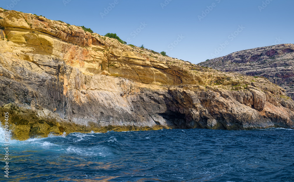 Yellow rocks of coast of Malta island in Mediterranean sea.