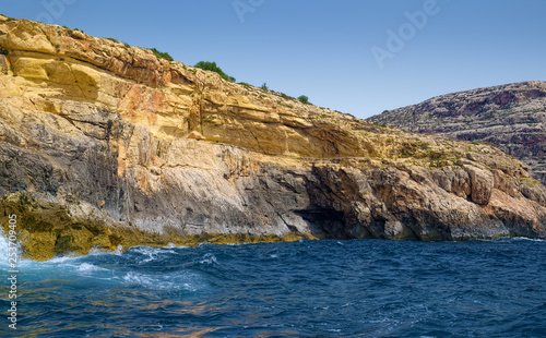 Yellow rocks of coast of Malta island in Mediterranean sea.