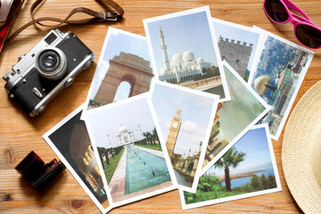 Old retro pictures and camera on wooden table globetrotter photography travel concept