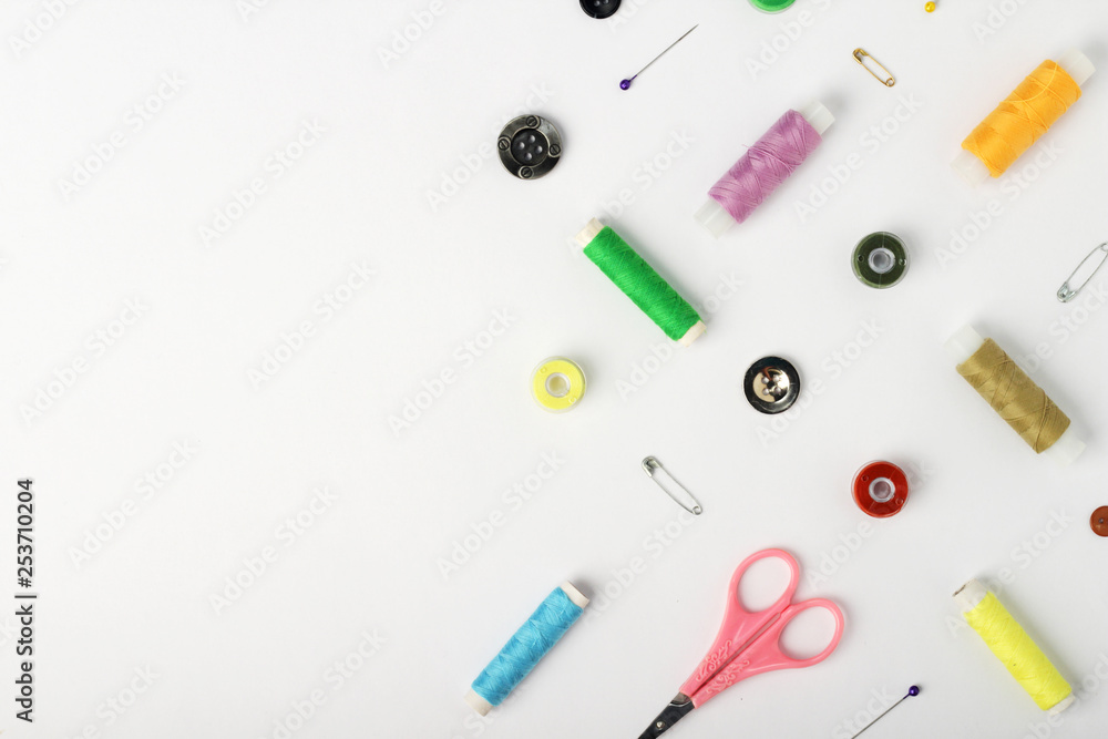 White background with different tools for sewing and tailoring White background with different tools for sewing and tailoring