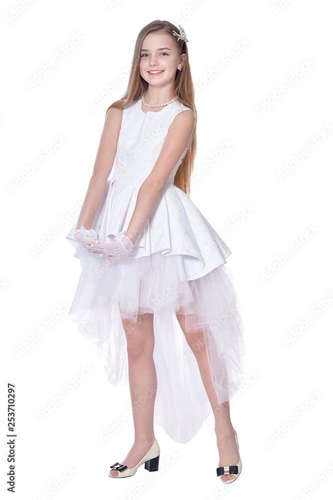 Happy little girl in carnival costume posing on white background