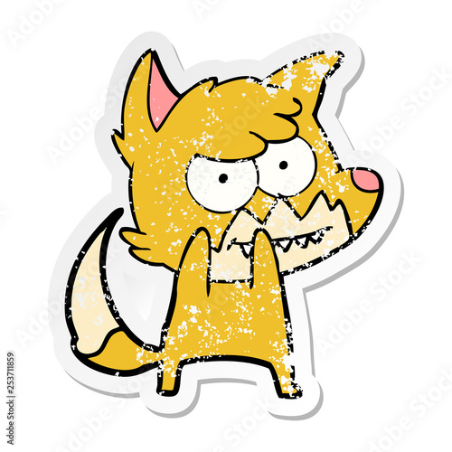 distressed sticker of a cartoon grinning fox