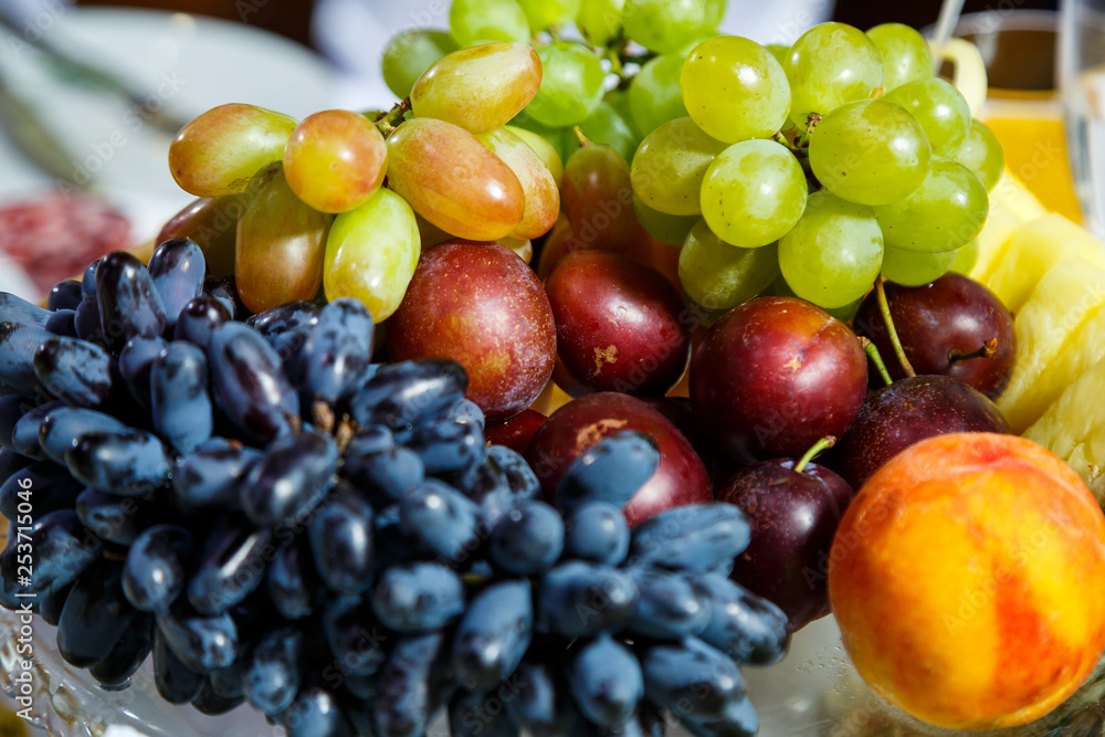 sliced fruits are beautifully arranged on a plate sliced fruits are beautifully arranged on a plate