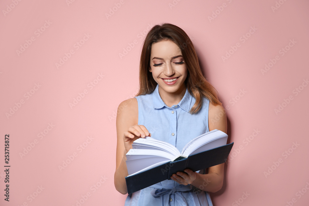Young woman with book on color background, space for text Young woman with book on color background, space for text