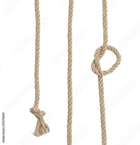 Strong cotton ropes with knots on white background