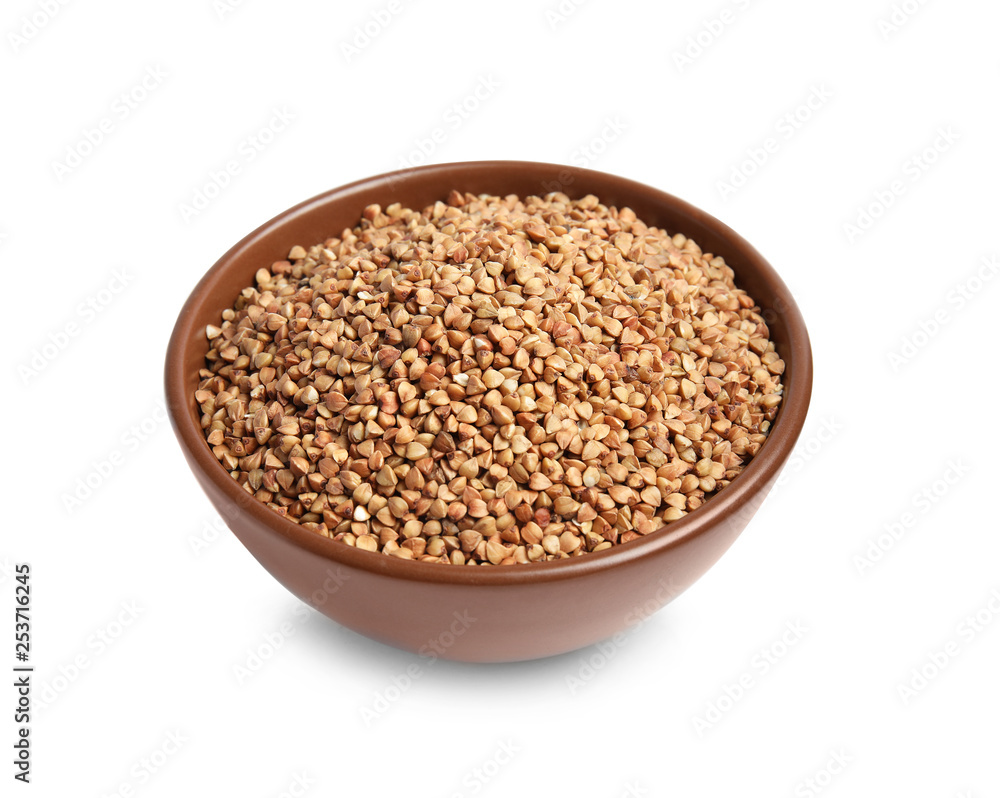 Bowl with uncooked buckwheat on white background Bowl with uncooked buckwheat on white background
