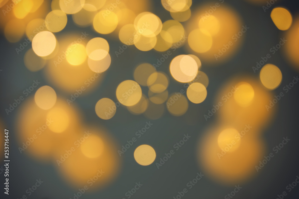 Blurred view of gold lights on dark background. Bokeh effect Blurred view of gold lights on dark background. Bokeh effect