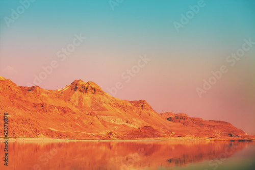 Mountainous coast of the Dead Sea in the evening at sunset