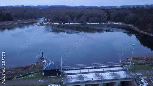 Reversing drone footage from a dam and pond in slomo. photo