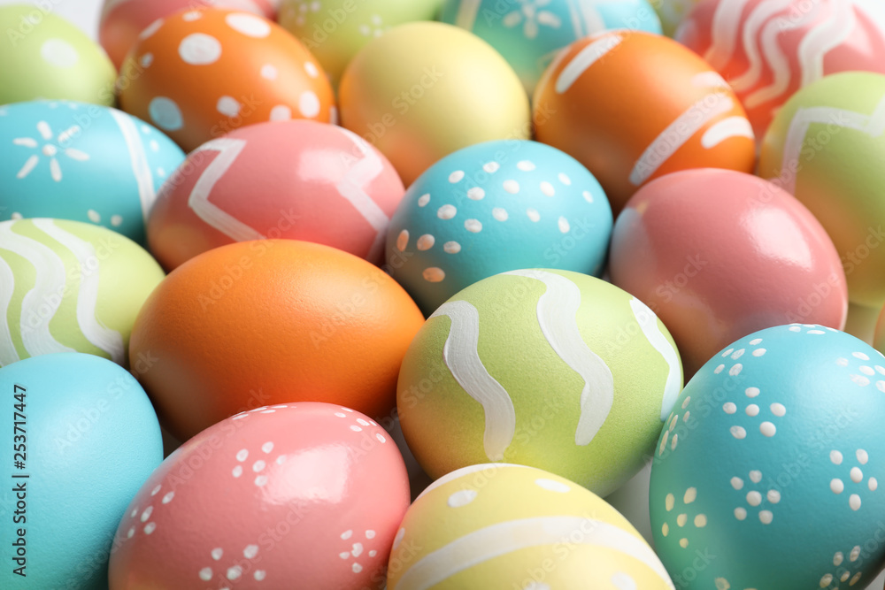 Many beautiful painted Easter eggs as background, closeup