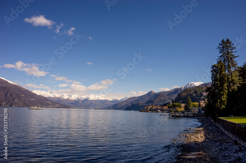 Italy  Bellagio  Lake Como  a large body of water with a mountain in the background