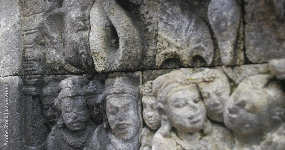 Panning close up shot of Borobudur ancient stone wall sculpture. Indonesia. Panning close up shot of Borobudur ancient stone wall sculpture. Indonesia.